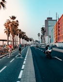 people riding motorcycle on road during daytime