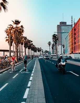people riding motorcycle on road during daytime