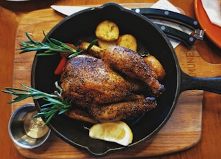 grilled meat on black round plate