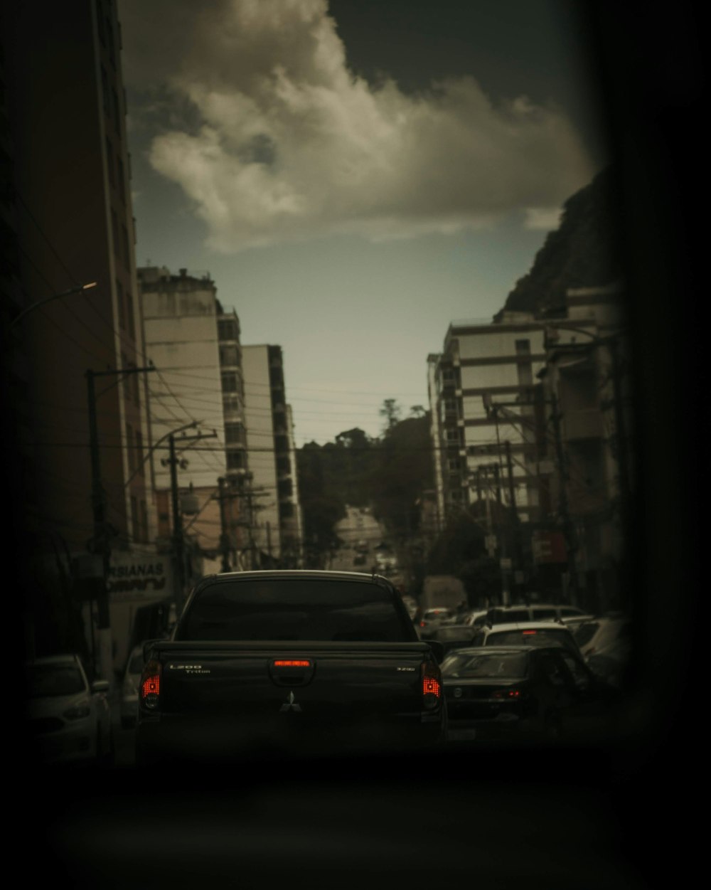 cars on road near buildings during daytime