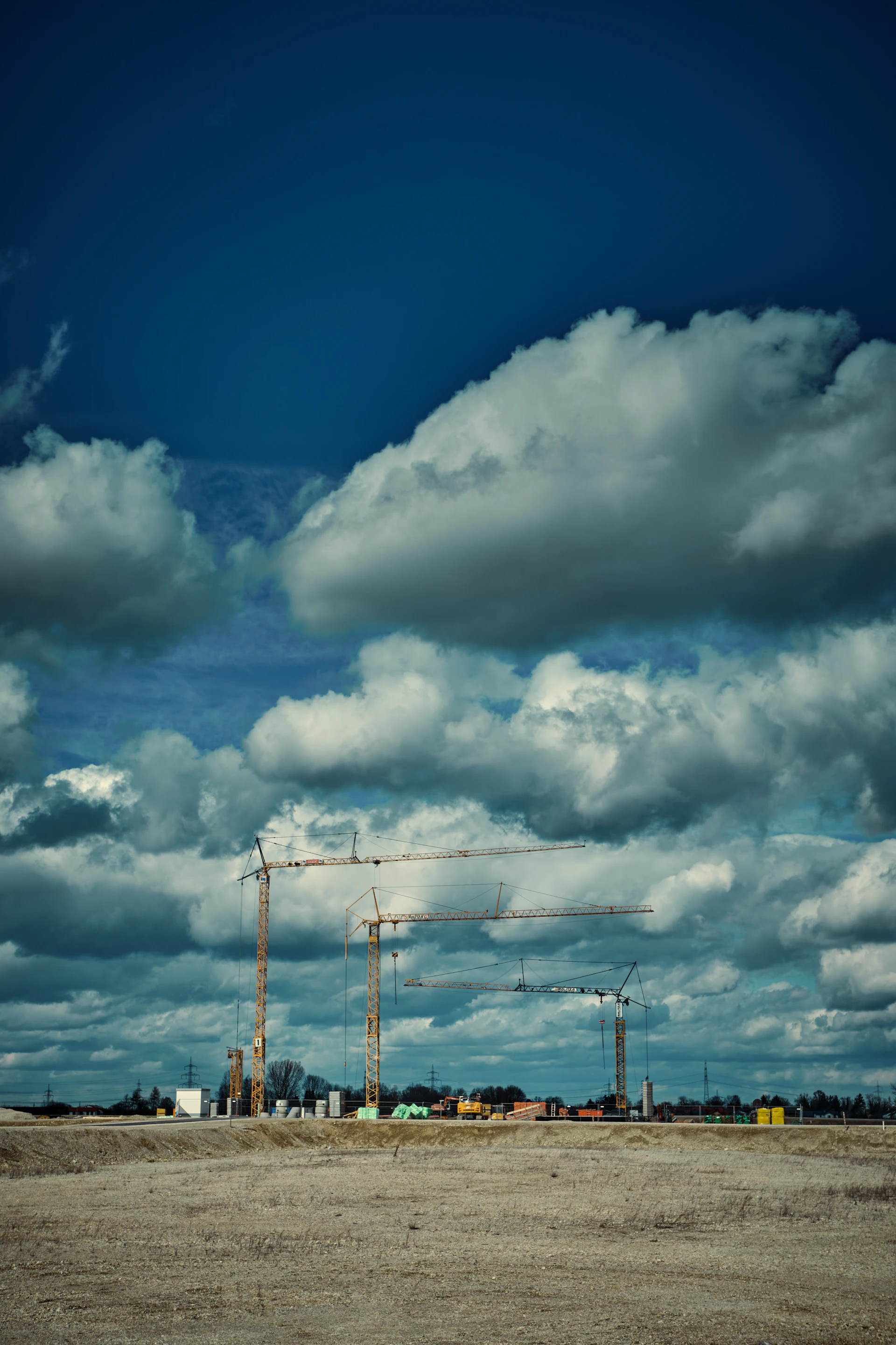 white clouds over the electric towers