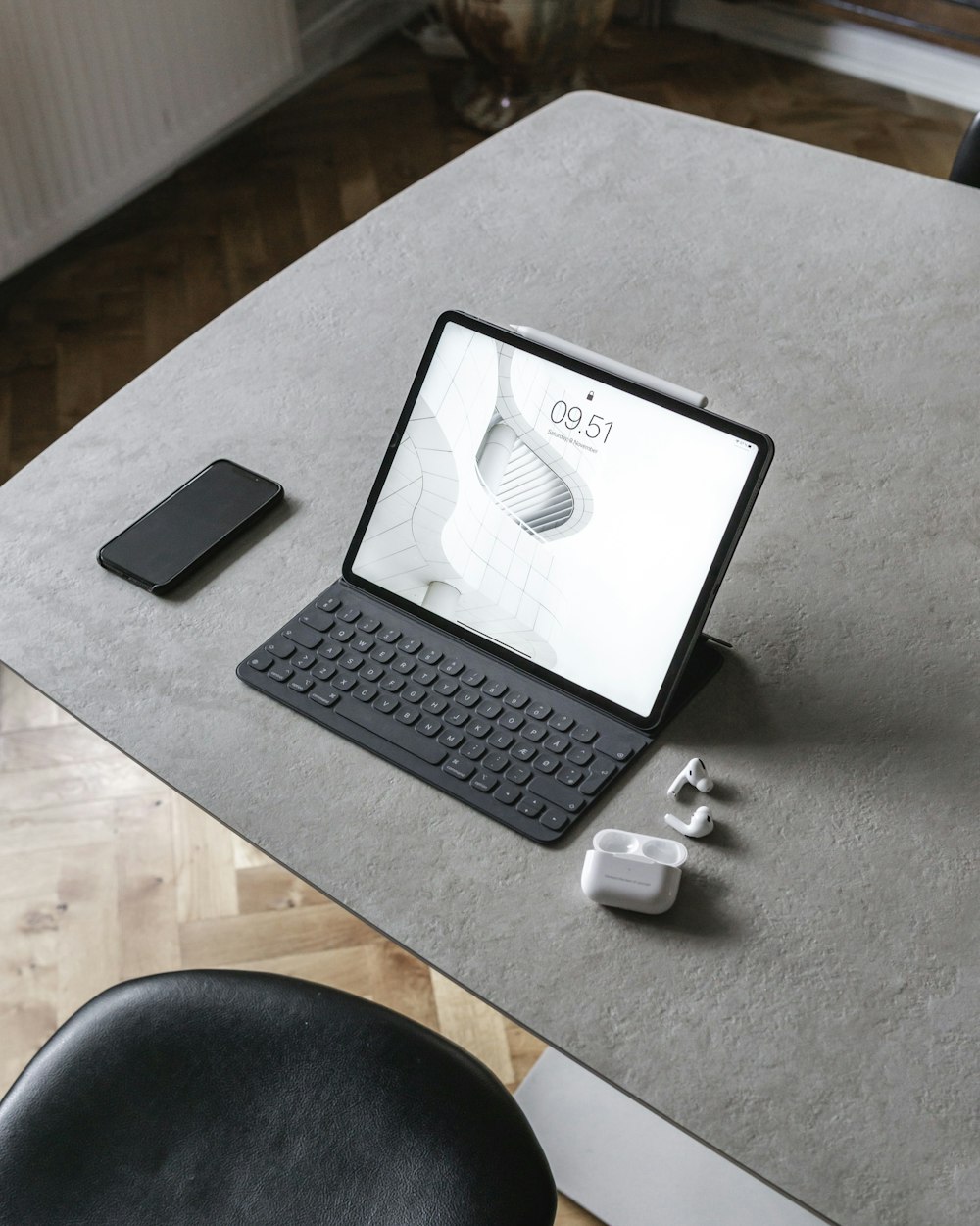 black and white laptop computer on white table