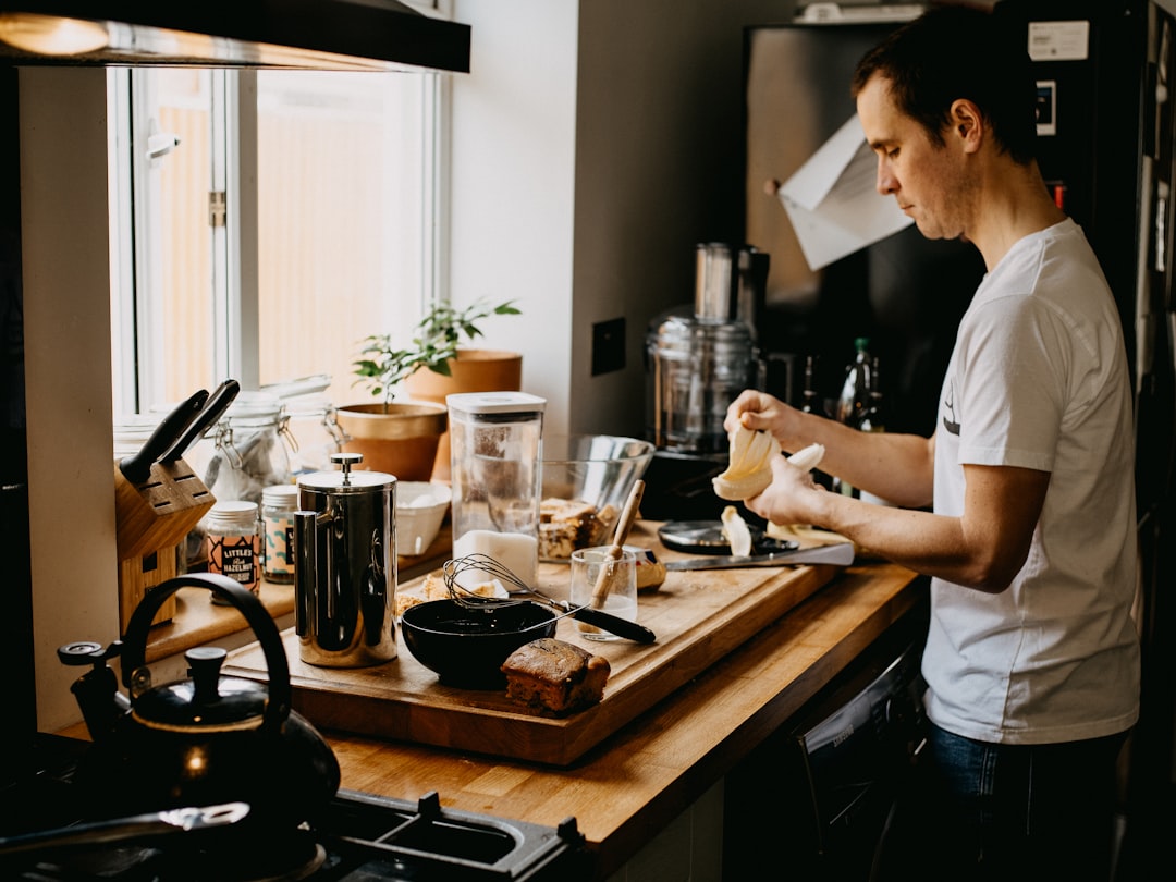 woman in white t-shirt standing in kitchen