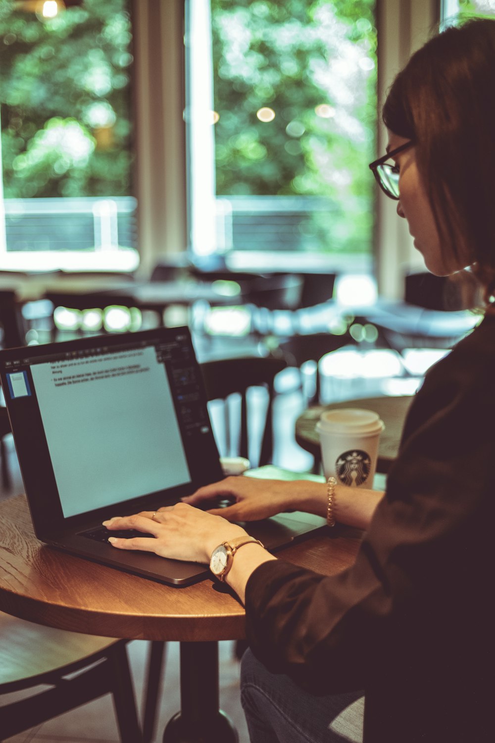 person using black laptop computer