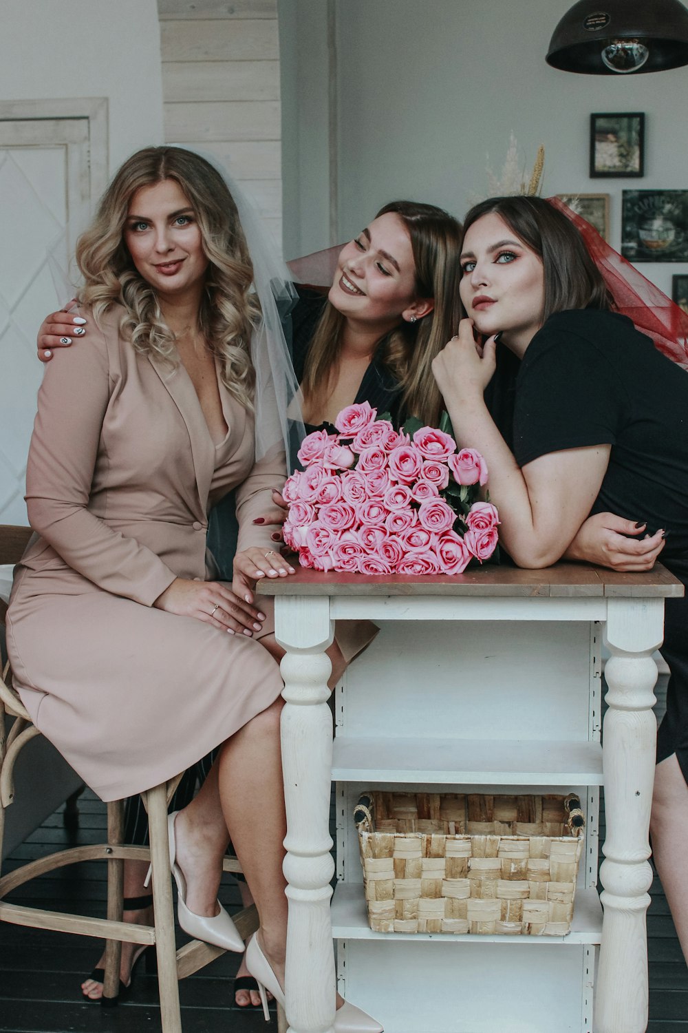 3 women sitting on chair smiling