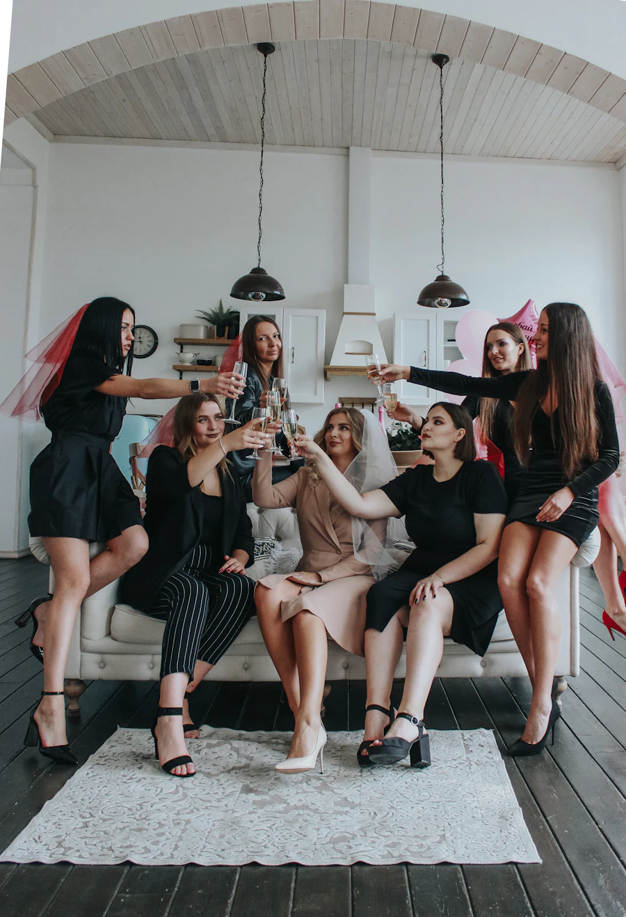 A group of friends gathered close together at a cozy night in