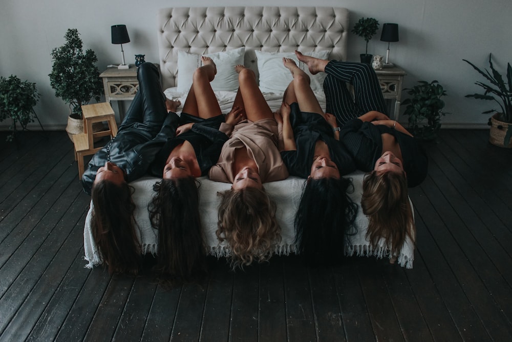 3 women lying on couch