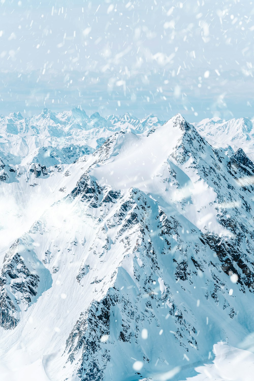 snow covered mountain during daytime