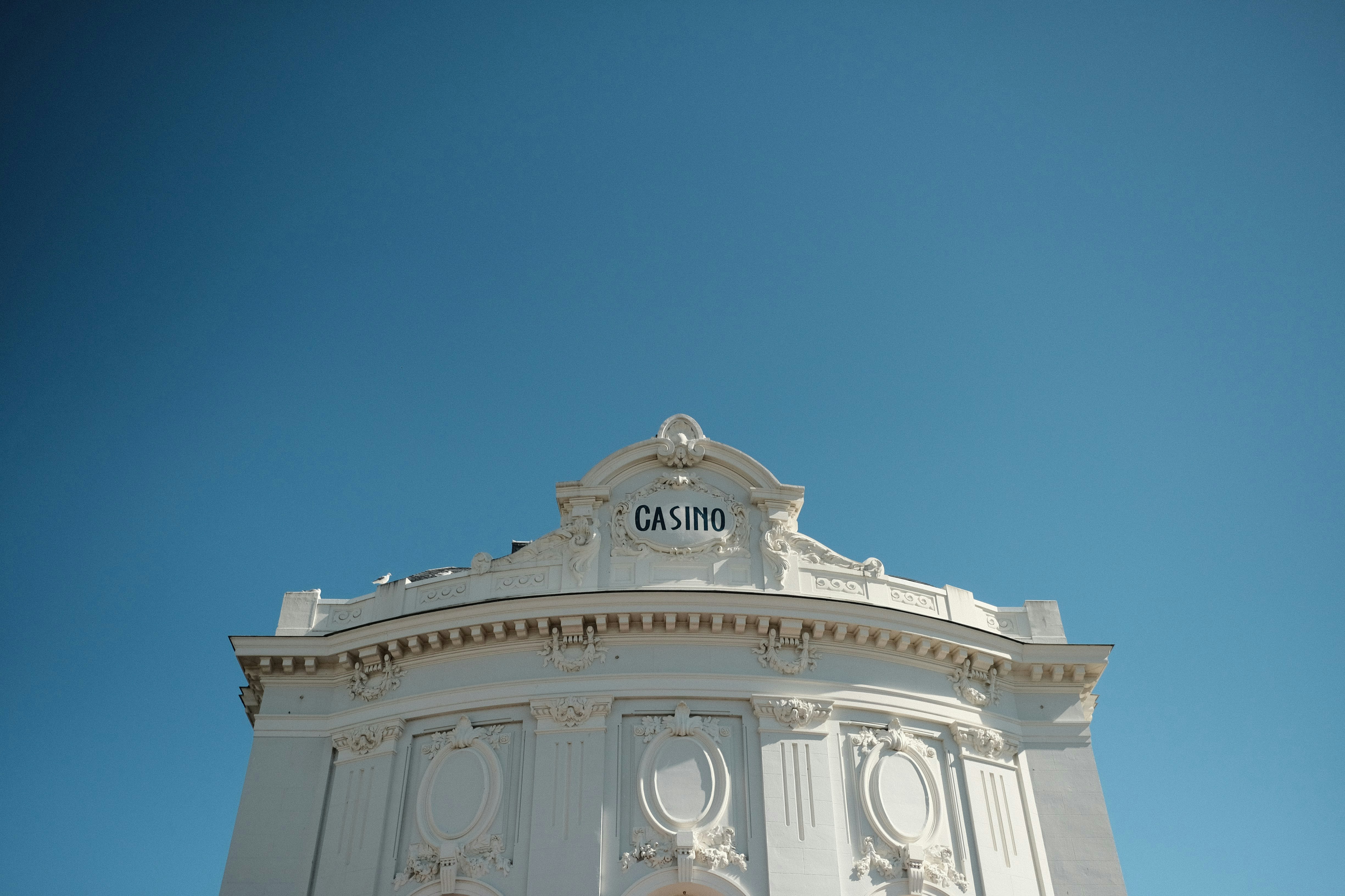 white concrete building under blue sky during daytime, 