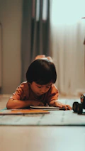 A peaceful moment of a child listening attentively during a bilingual storytime under warm natural light.
