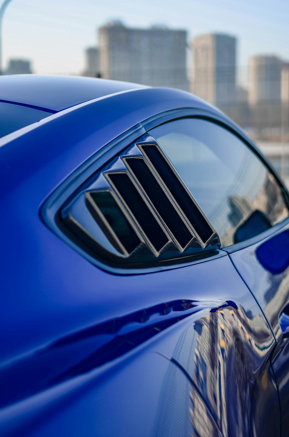 blue car with white and black logo