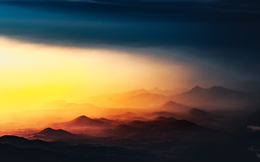 silhouette of mountains during sunset