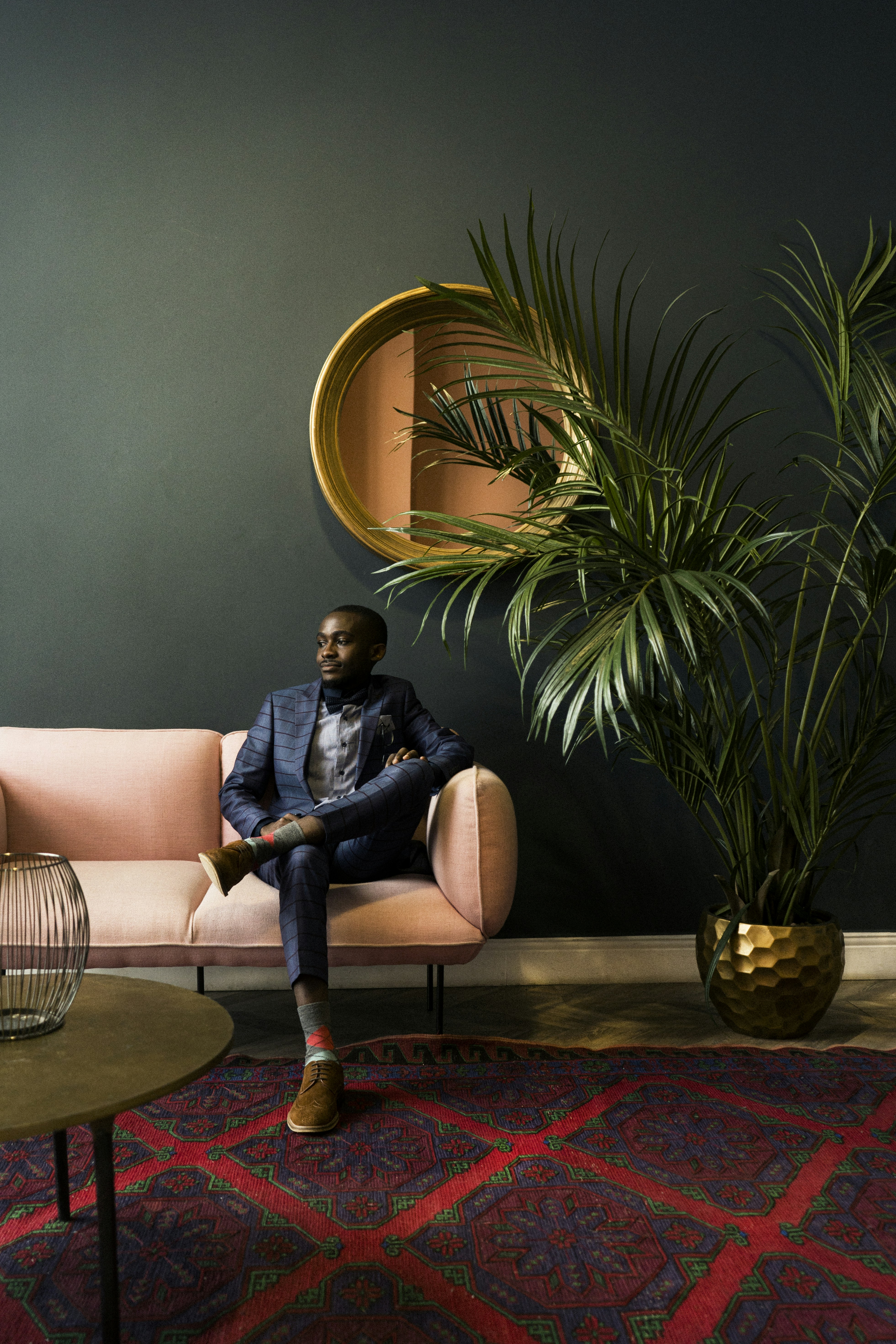 woman in blue denim jacket sitting on white sofa
