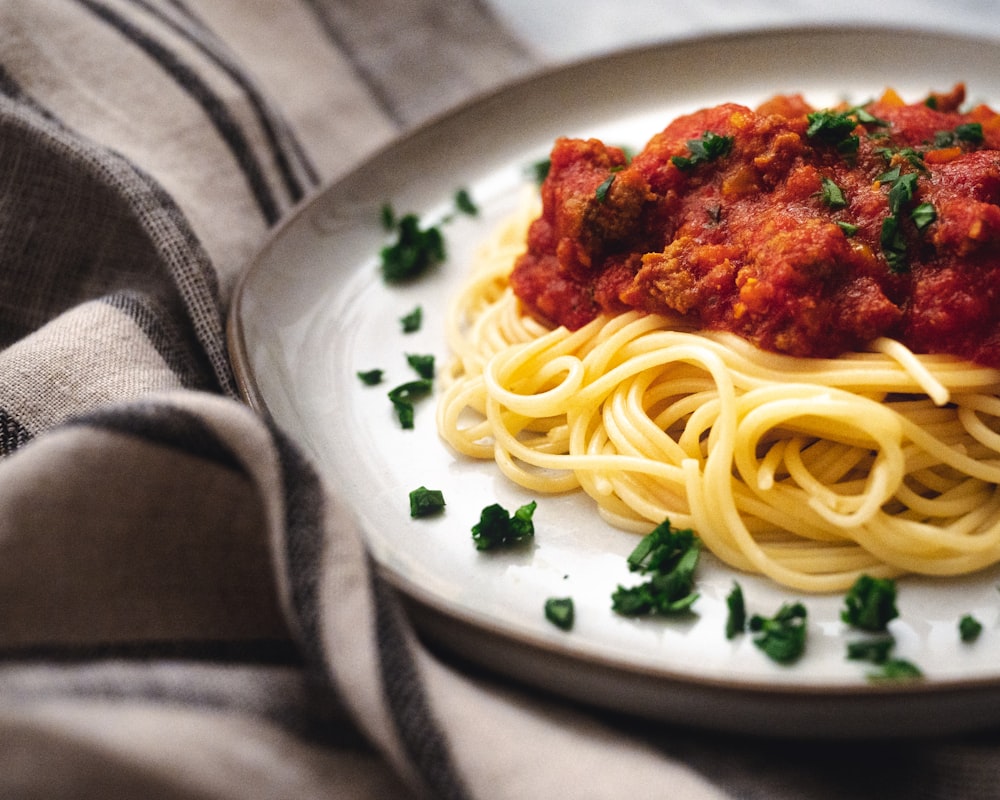 spaghetti on white ceramic plate