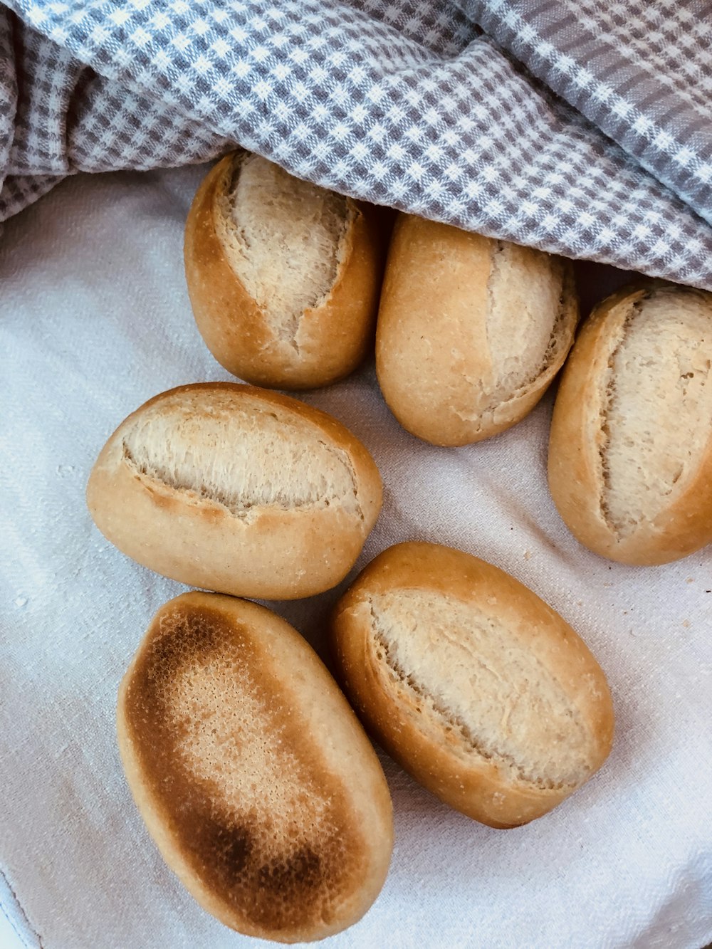 brown bread on white textile