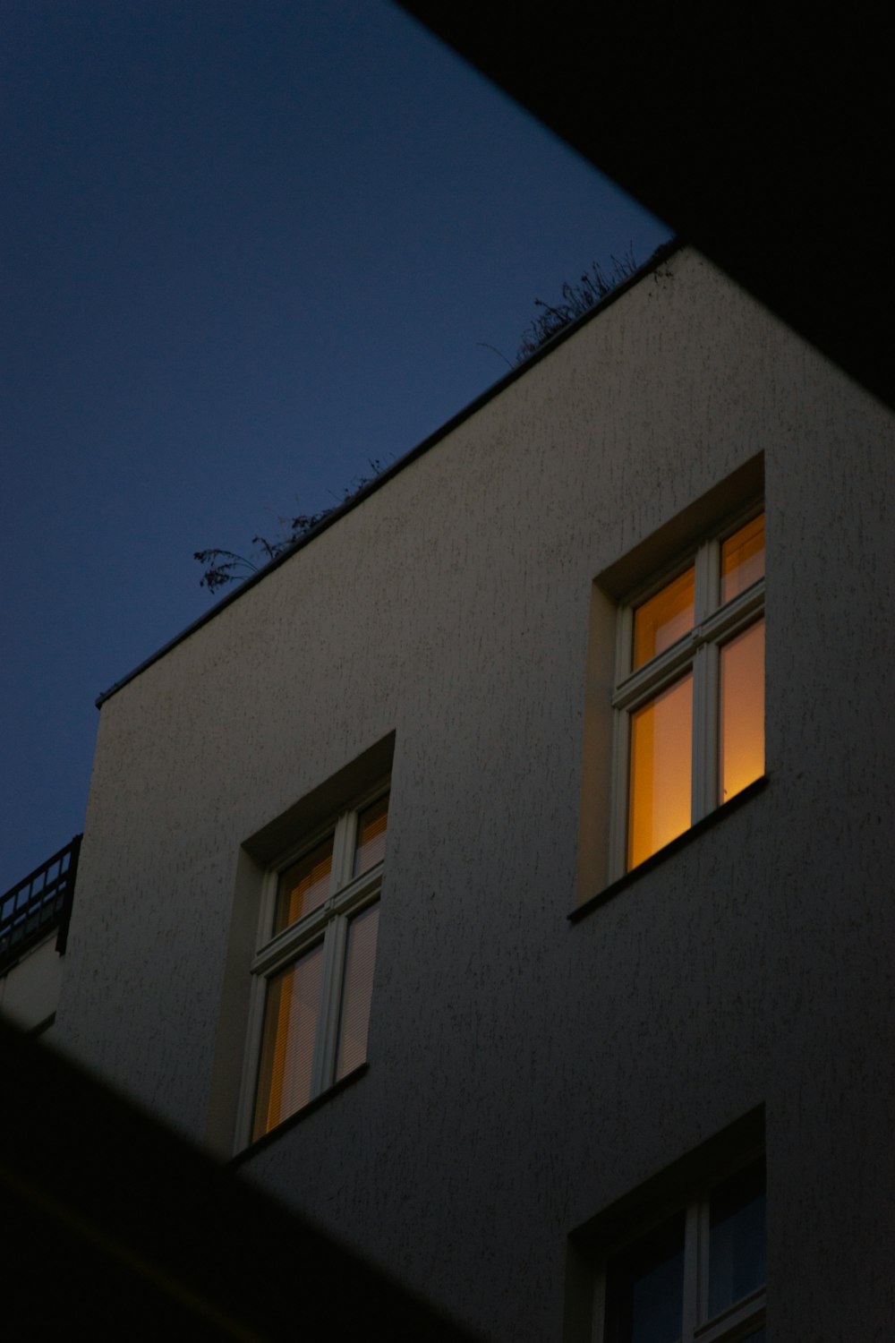 brown concrete building with glass windows