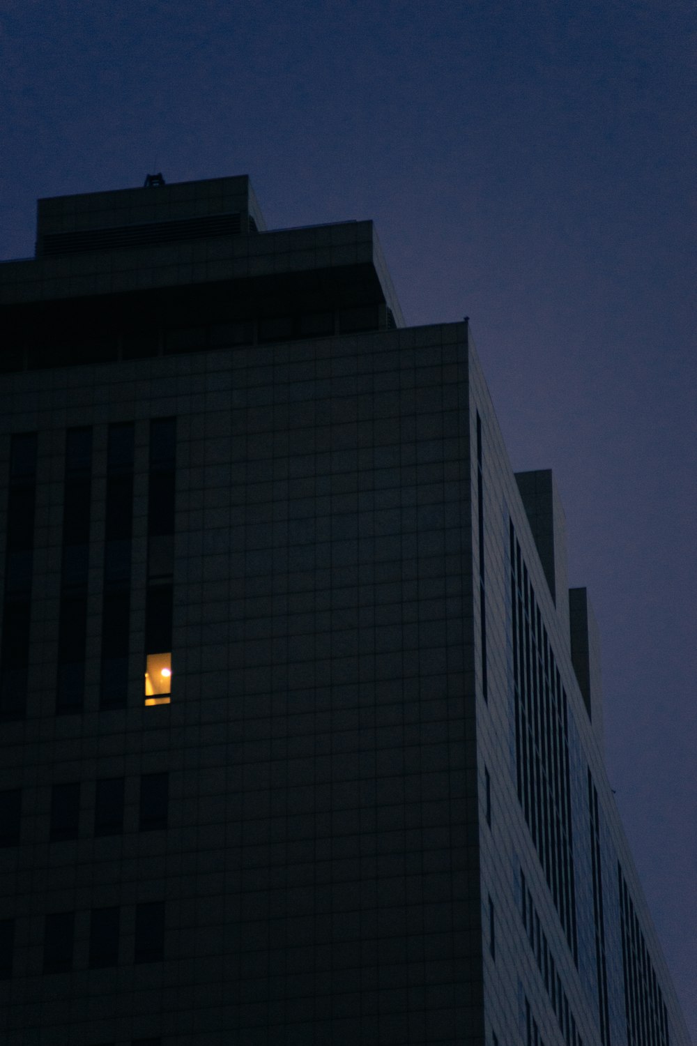 gray concrete building during night time