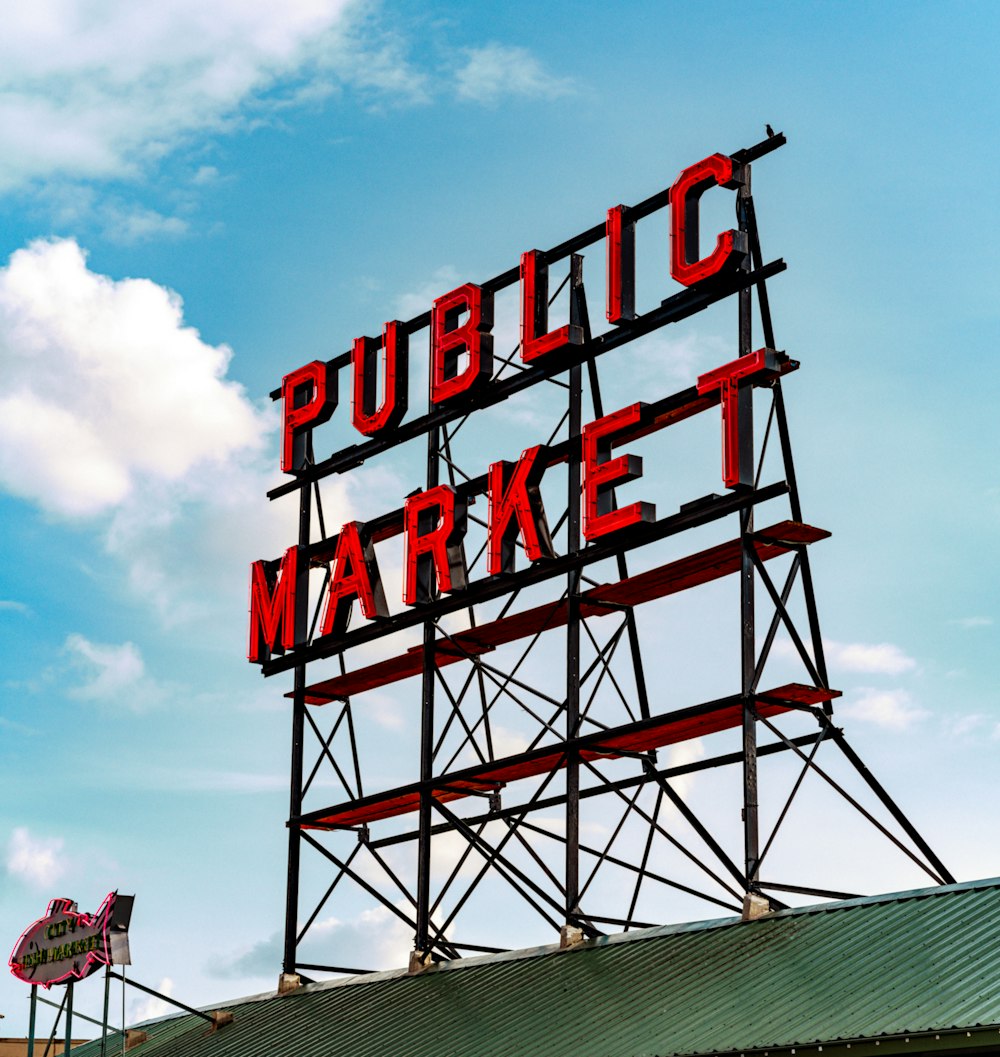 a public market sign on top of a building