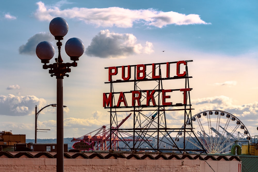 a public market sign on top of a building