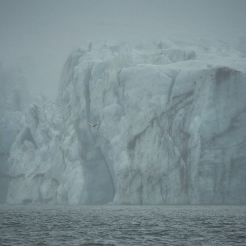 white ice on body of water during daytime