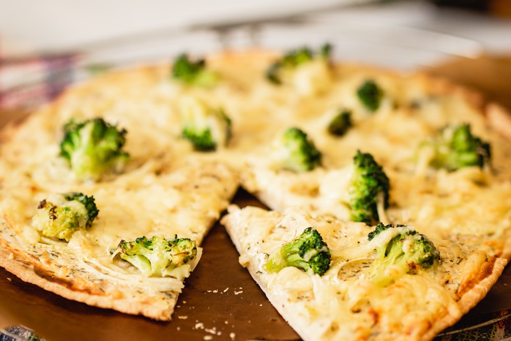 brown and white pizza on brown wooden table