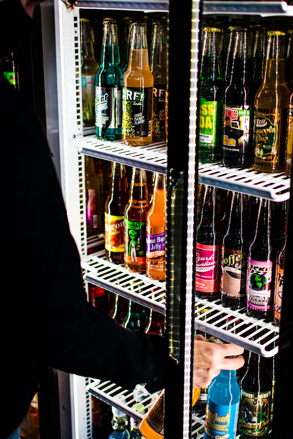 assorted bottles in white refrigerator