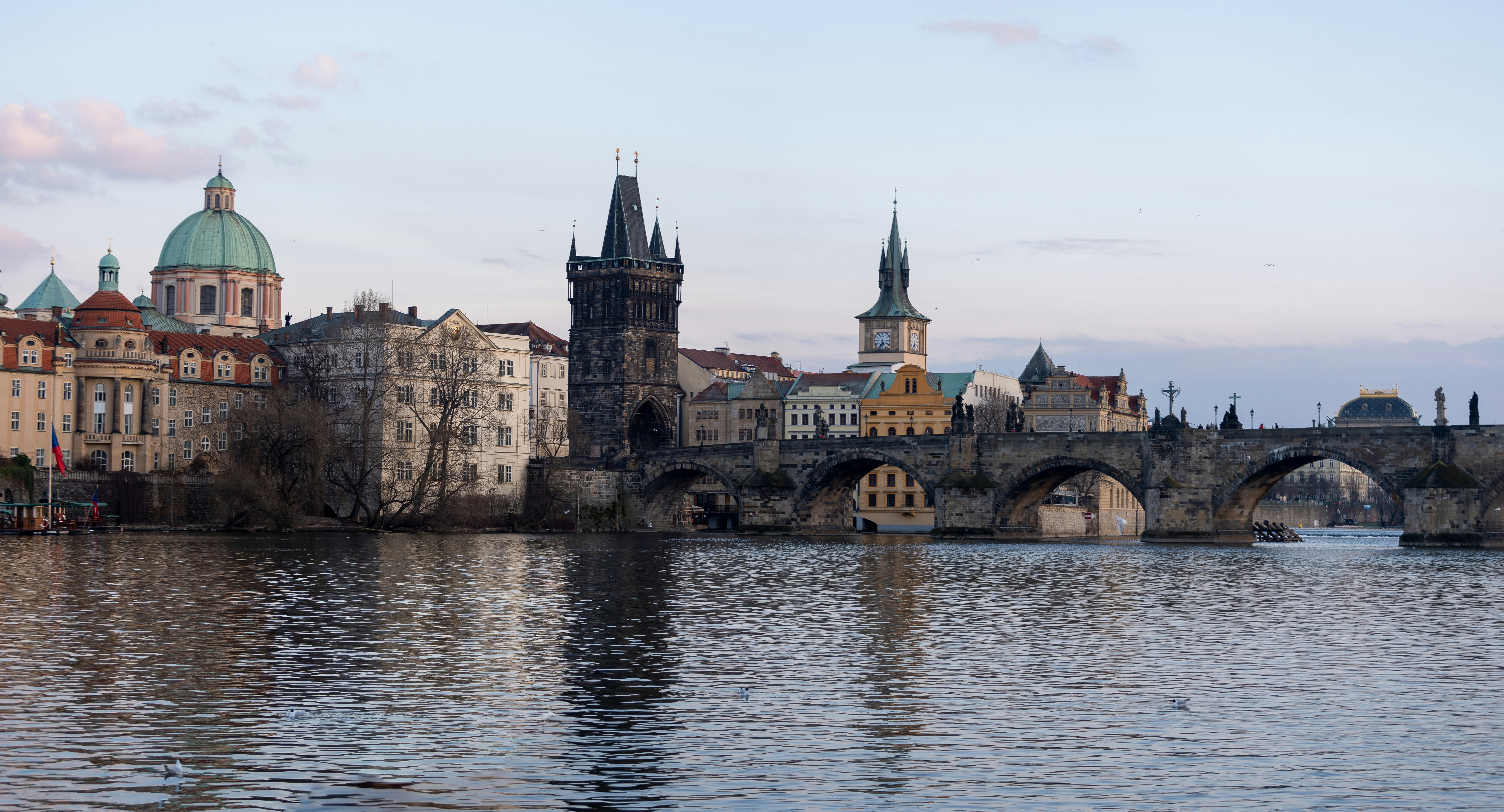 brown concrete building near body of water during daytime