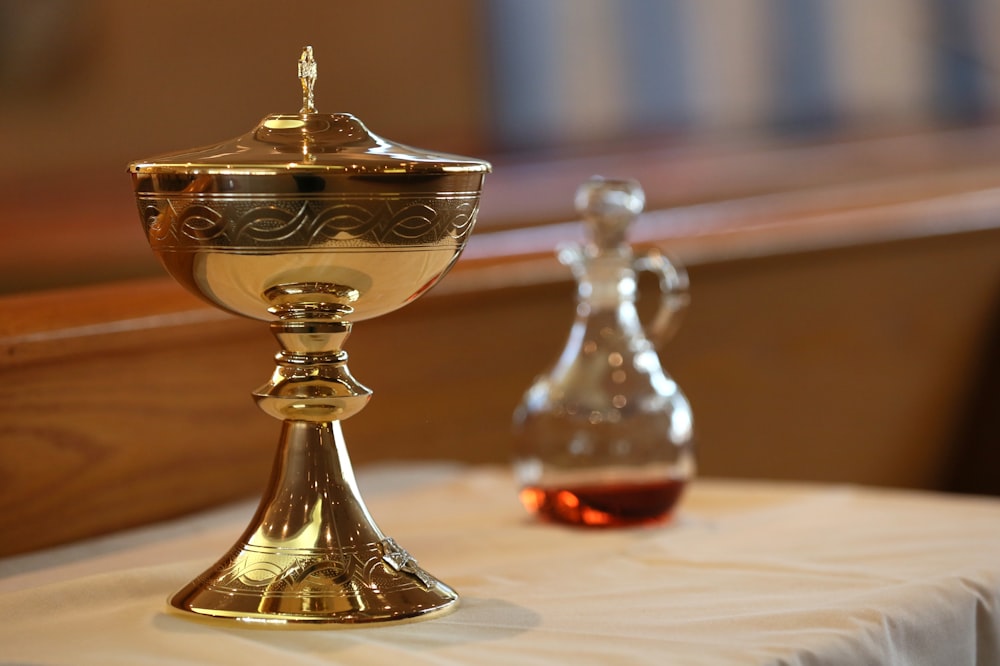 gold and silver footed glass on white table