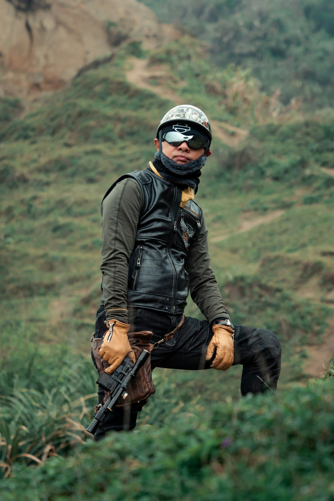 man in black leather jacket wearing black helmet and black and red helmet