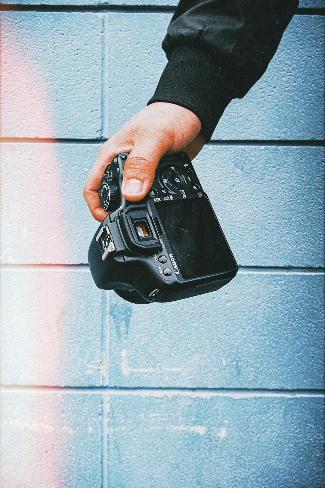 person holding black electronic device