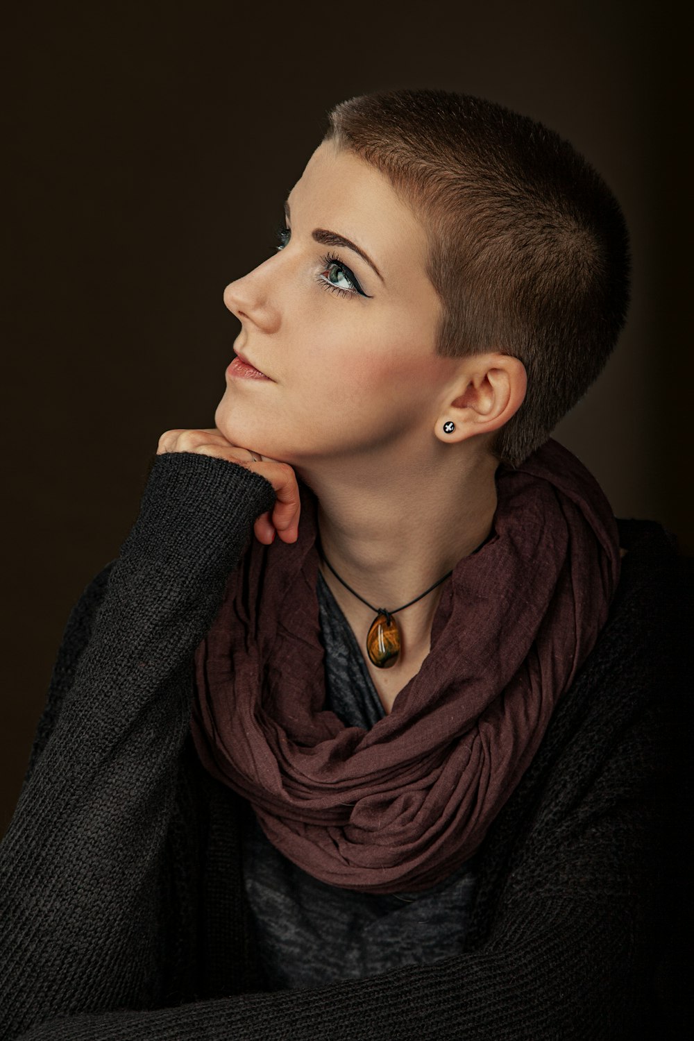 woman in brown scarf and black coat