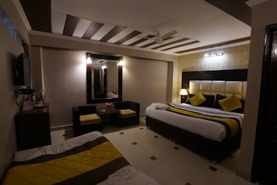 A cozy furnished room with a double bed and modern decor.