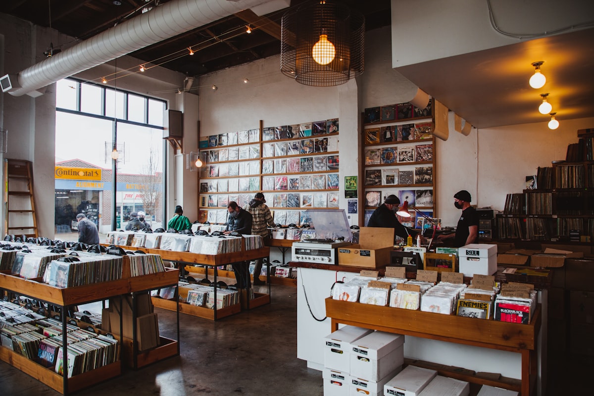 People browsing vinyl records inside a record shop