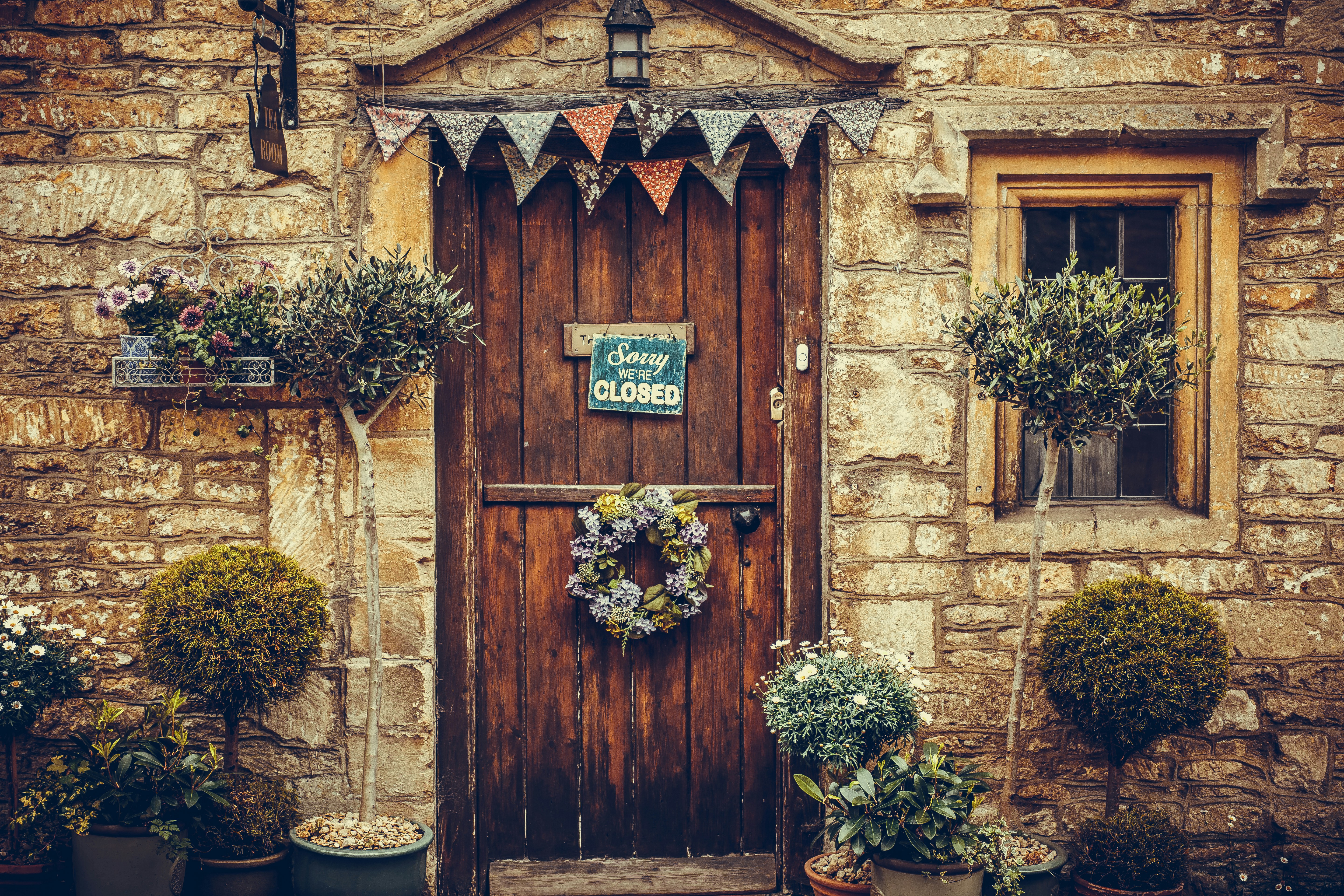 brown wooden door with flowers
