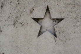 silver star on white surface