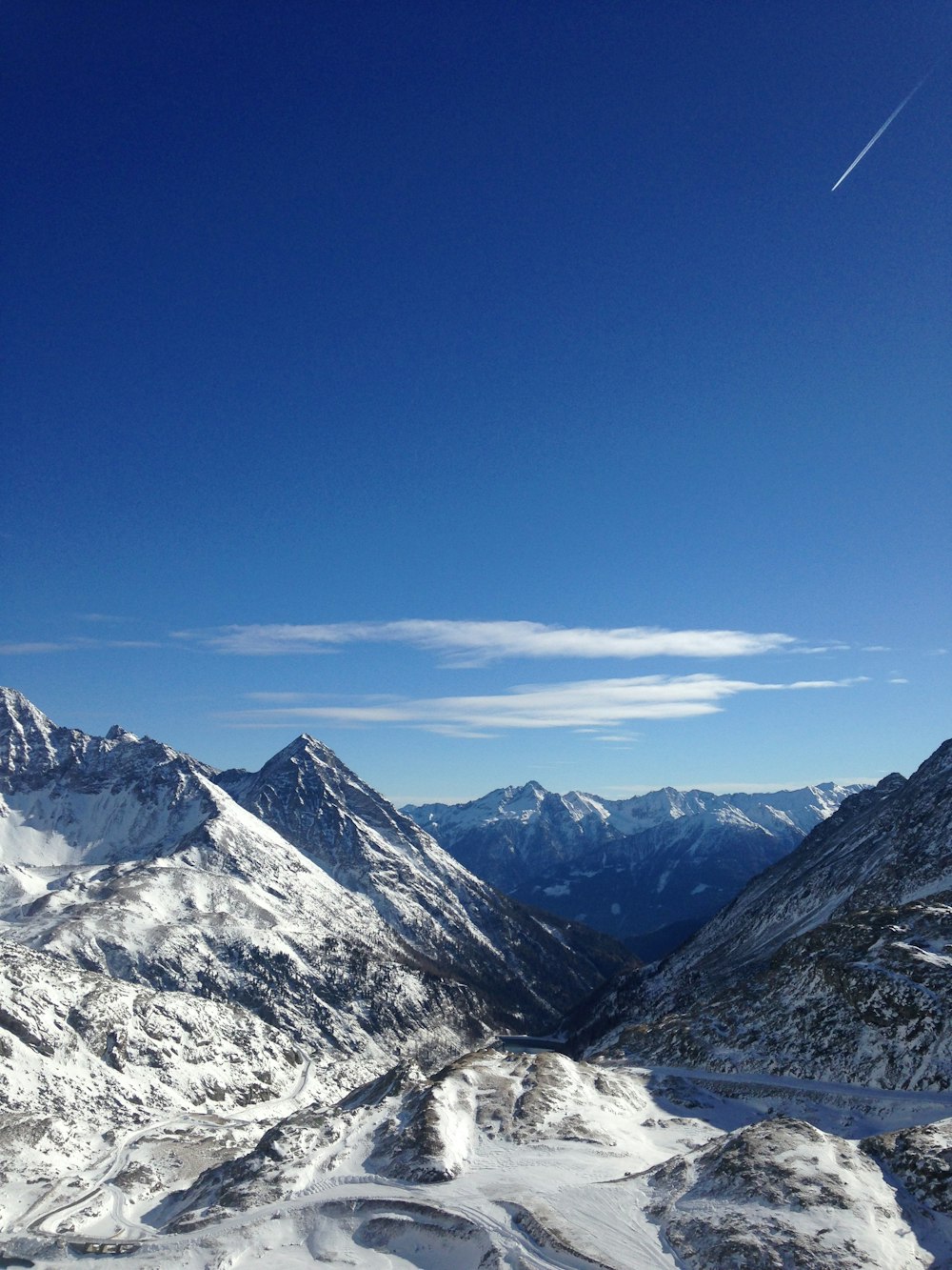 snow covered mountain under blue sky during daytime