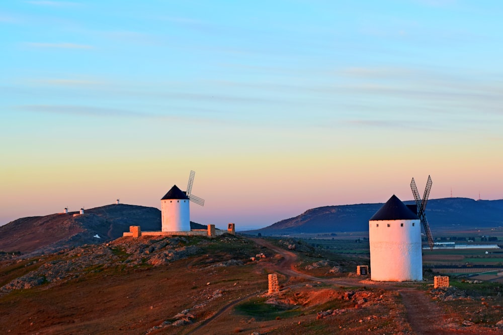 white concrete building on top of hill