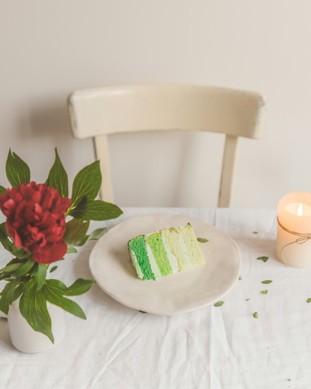 red rose on white ceramic plate