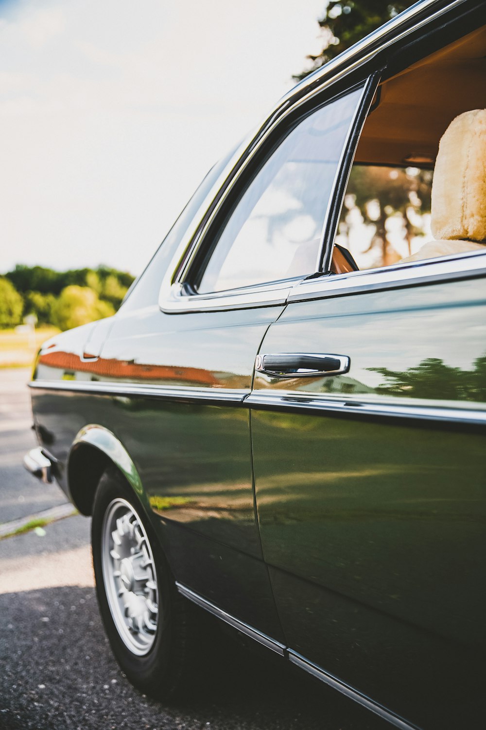 green car on road during daytime