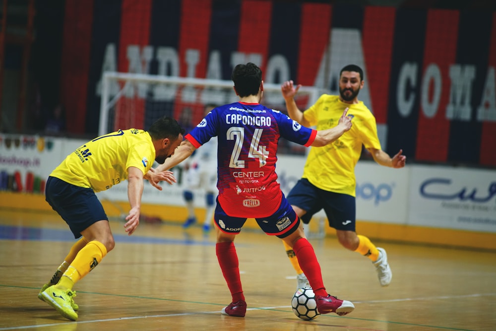 men playing soccer on field