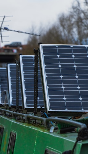 blue solar panels on green metal frame