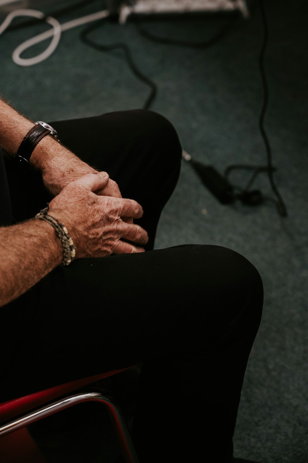 person wearing silver link bracelet watch