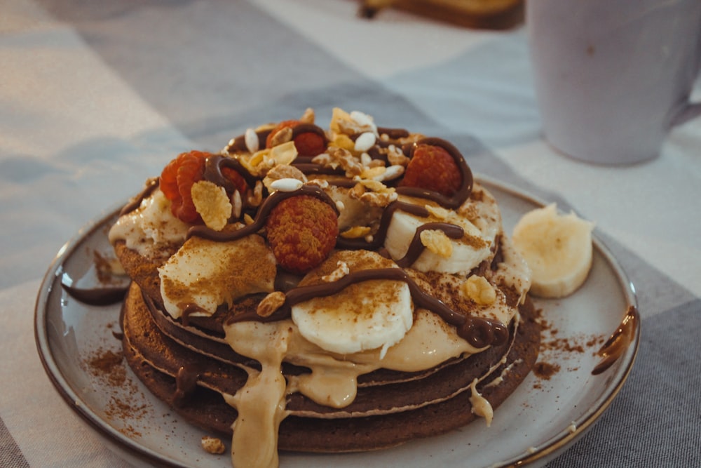 brown and white pastry on black ceramic plate