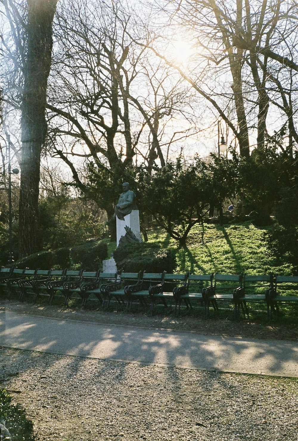 white statue in the middle of the park