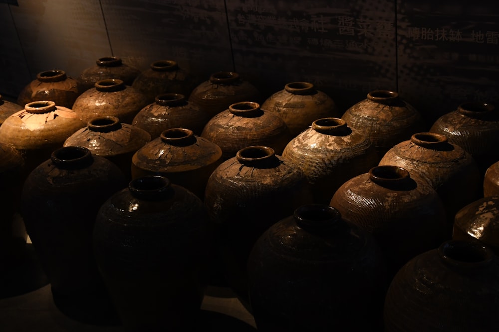 brown clay pots on white table