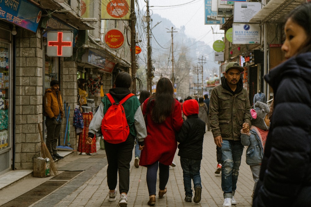 people walking on sidewalk during daytime