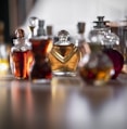 clear glass perfume bottle on table