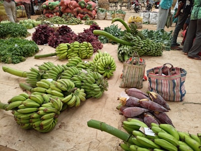 green banana fruit on brown woven basket