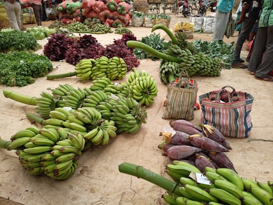 green banana fruit on brown woven basket