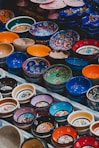 assorted color bowls on white plastic container